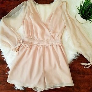 Venus blush romper w/ shoulder openings. Size 4!